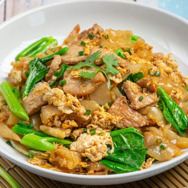 ASIANO Thai & Sushi Bar's Pad See Ew with wide noodles, pork, egg, and Chinese broccoli.